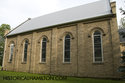 Side Of The Church With Tall Windows