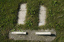 Two Headstones In The Ground