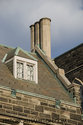 Attic Window And Stone Chimney
