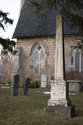 Tombstone With Church In Background