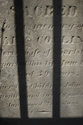 Tombstone Behind Fence