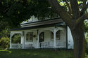 Corner View Of White Wooden House