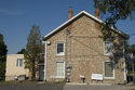 Side View With Two Brick Chimneys
