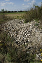 Old Stone Piled Around Foundation