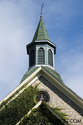Church Spire With Ivy Growing On Stones
