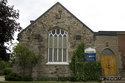 Front Of The Stone Baptist Church With Stained Glass Windows