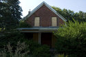 Front Of Abandoned Brick House