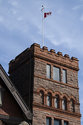 Red Stone Tower With Flag