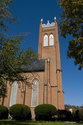 Looking Up At Church Tower From Street