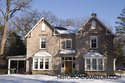 Front Of The Stone Mansion On Halson Street
