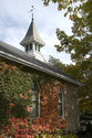 Colourful Vines On The School With Bell Tower In The Background
